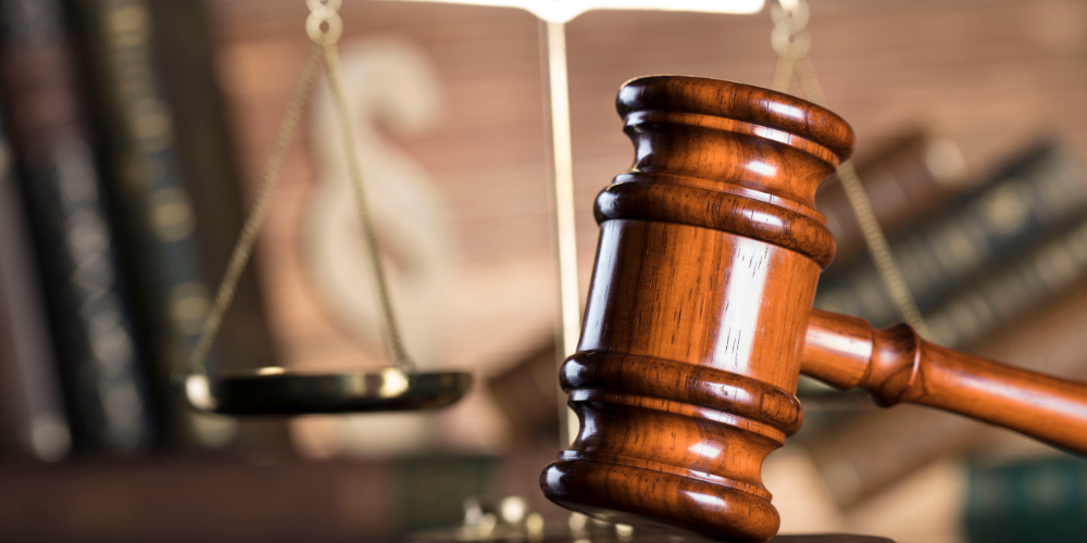 Gavel and scales of justice representing legal guidance in polygraph examinations.
