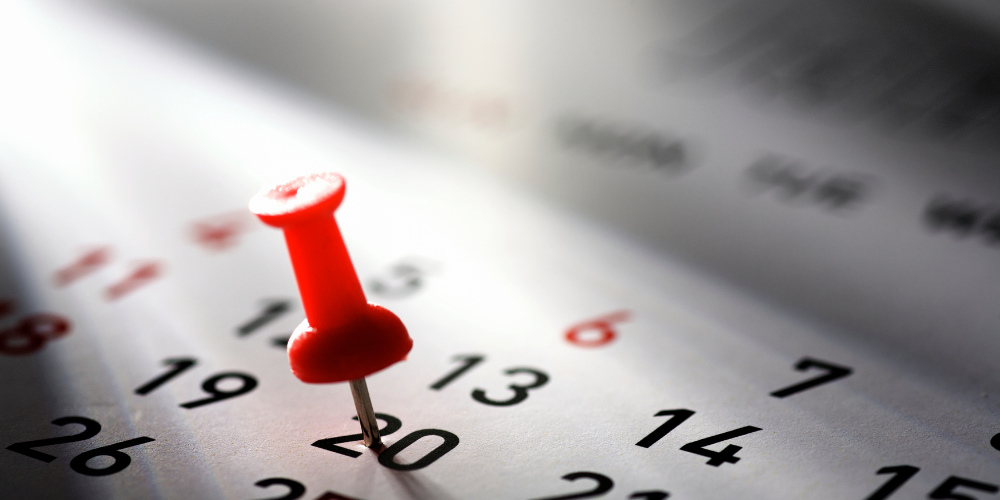 Calendar with a pin marking a specific date, representing scheduled periodic polygraph examinations.