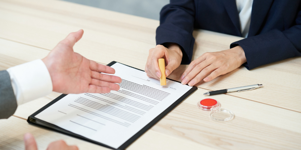 Person presenting a written statement to another person for review, representing credibility and analysis.